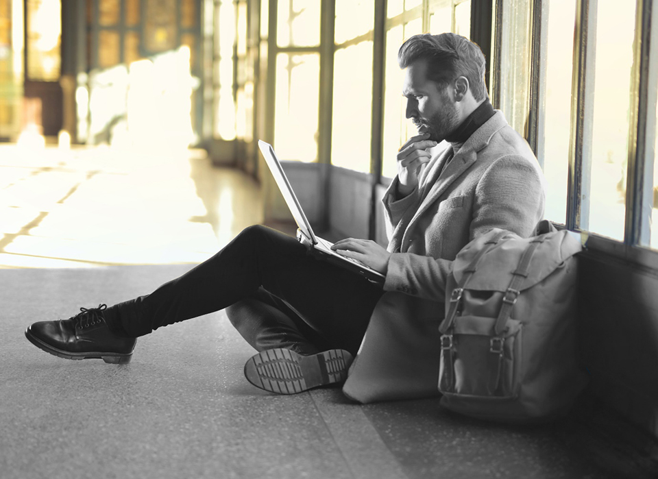 Listening man on laptop